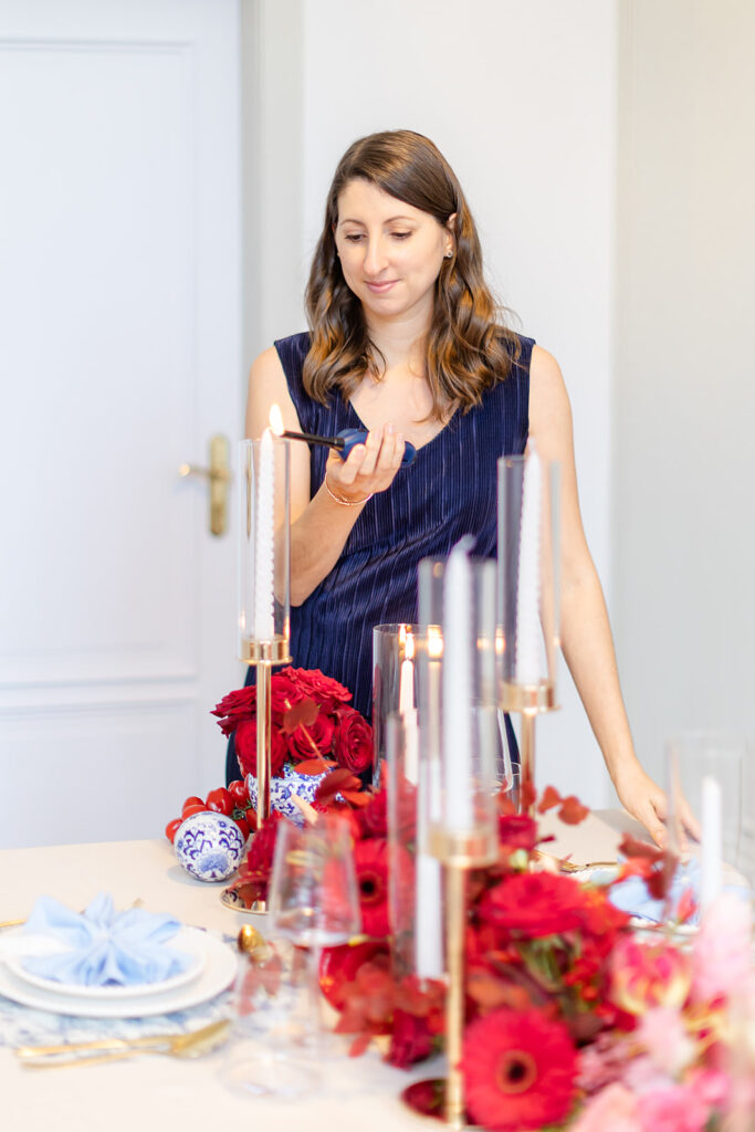 Nadine Eich, founder of Something Blue Weddings, preparing the reception table — fine art destination wedding planner Germany